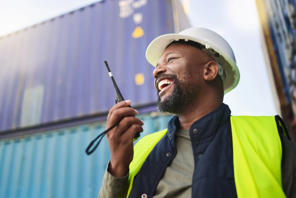 Logistics supply chain worker on walkie talkie