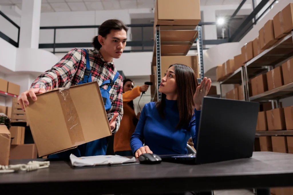 Warehouse workers discussing integrated carriers