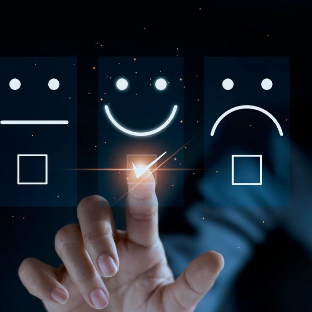 Finger of businessman touching and check mark icon face emoticon smile on dark background, service mind, service rating. Satisfaction and customer service concept